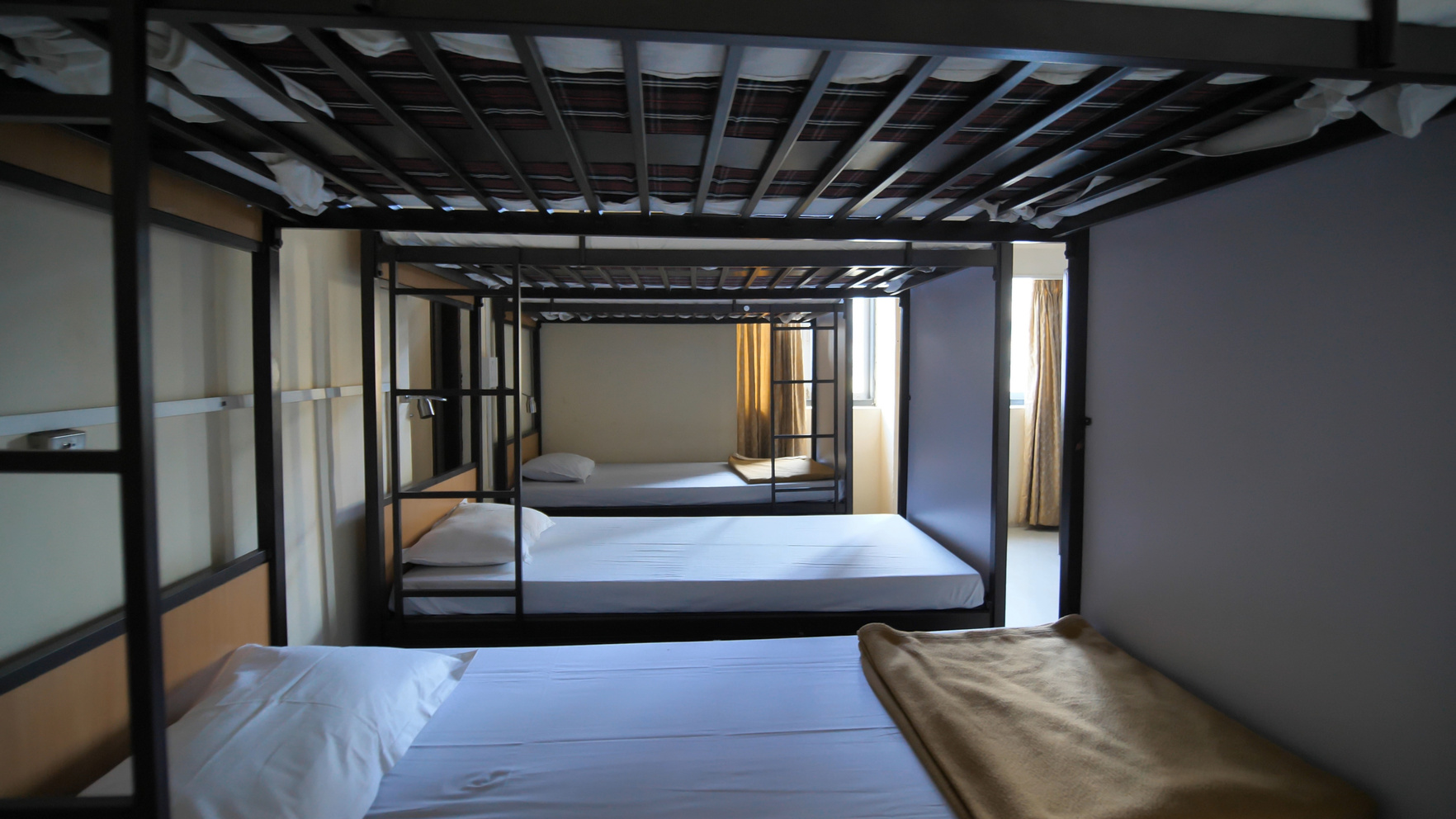 Empty room for a cheap hostel with bunk beds